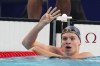 Leon Marchand of France, celebrates after winning the men's 200-meter individual medley final at the 2024 Summer Olympics, Friday, Aug. 2, 2024, in Nanterre, France. (AP Photo/Natacha Pisarenko)