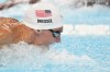 United States' Caeleb Dressel competes in a men's 100-meter butterfly heat at the Summer Olympics in Nanterre, France, Friday, Aug. 2, 2024. (AP Photo/Ashley Landis)
