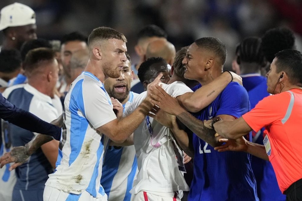 France and Argentina players argue at the end of a quarter final soccer match between France and Argentina, at Bordeaux Stadium, during the 2024 Summer Olympics, Friday, Aug. 2, 2024, in Bordeaux, France. (AP Photo/Moises Castillo)