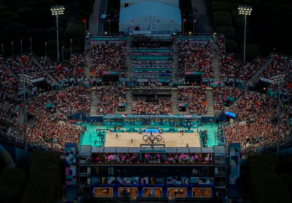 A general view of a beach volleyball match as seen from the Eiffel Tower, during the 2024 Summer Olympics, in Paris, France, Friday, Aug. 2, 2024. (Eloisa Lopez/Poool Photo via AP)