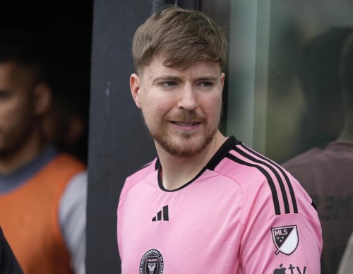 FILE - Jimmy Donaldson, the popular YouTube video maker who goes by MrBeast, wears a Lionel Messi jersey as he stands in a sideline box at the start of an MLS soccer match between Inter Miami and CF Montreal, March 10, 2024, in Fort Lauderdale, Fla. MrBeast is facing complaints about the safety of contestants from the preliminary rounds of his ambitious “Beast Games