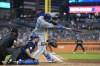 Kansas City Royals' Salvador Perez connects for a RBI double during the seventh inning of a baseball game against the Detroit Tigers, Friday, Aug. 2, 2024, in Detroit. (AP Photo/Carlos Osorio)