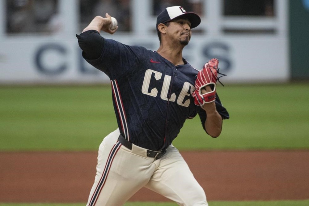 Cleveland Guardians starting pitcher Carlos Carrasco delivers against the Baltimore Orioles during the first inning of a baseball game in Cleveland, Friday, Aug. 2, 2024. (AP Photo/Phil Long)