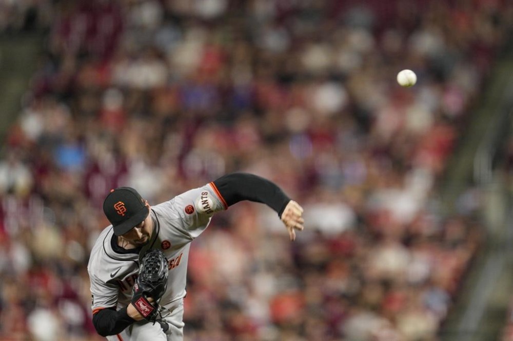 San Francisco Giants pitcher Blake Snell throws during the sixth inning of a baseball game against the Cincinnati Reds, Friday, Aug. 2, 2024, in Cincinnati. (AP Photo/Jeff Dean)