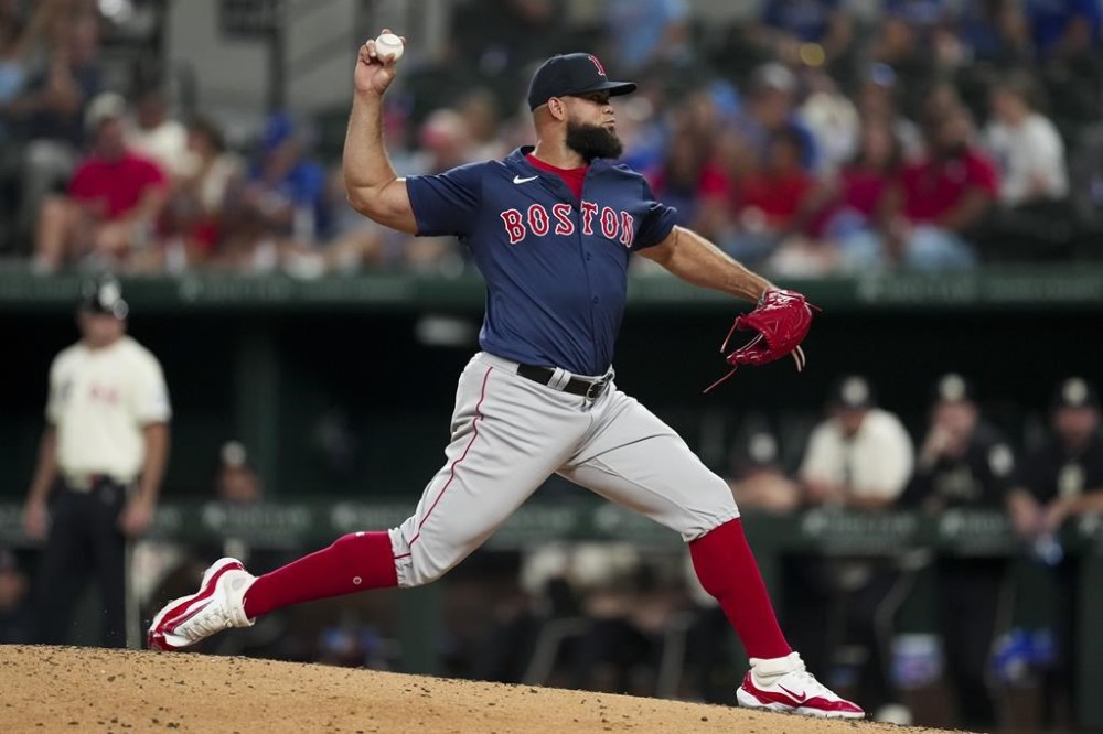 Boston Red Sox relief pitcher Luis Garcia throws during the ninth inning of a baseball game against the Texas Rangers, Friday, Aug. 2, 2024, in Arlington, Texas. (AP Photo/Sam Hodde)