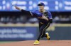 Seattle Mariners starting pitcher Bryan Woo throws against the Philadelphia Phillies during the first inning in a baseball game, Friday, Aug. 2, 2024, in Seattle. (AP Photo/John Froschauer)