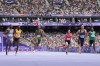 Louie Hinchliffe, of Britain, wins a heat in the men's 100-meter ahead of Noah Lyles, of the United States, at the 2024 Summer Olympics, Saturday, Aug. 3, 2024, in Saint-Denis, France. (AP Photo/David J. Phillip)
