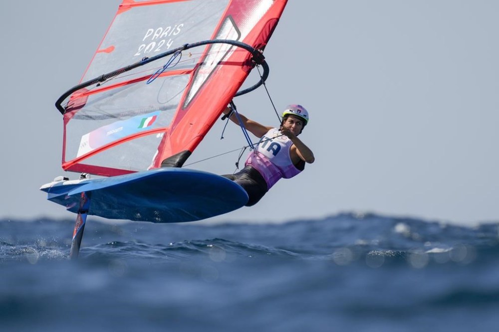 Marta Maggetti, of Italy, warms up before a women's iQFOiL windsurfing class during the 2024 Summer Olympics, Saturday, Aug. 3, 2024, in Marseille, France. (AP Photo/Carolyn Kaster)