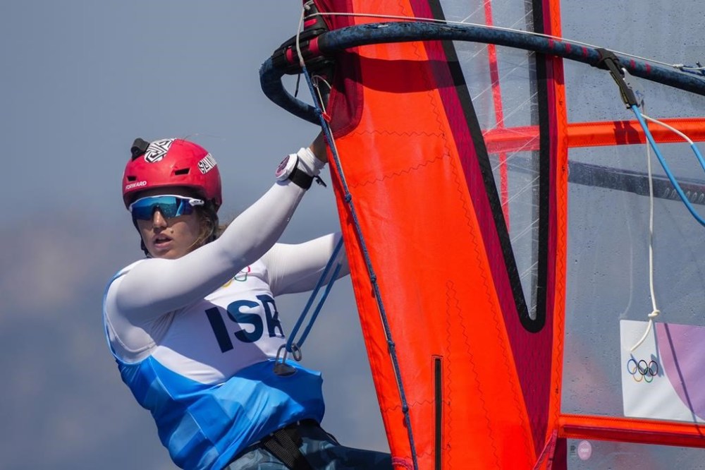 Sharon Kantor, of Israel, warms up before a women's iQFOiL windsurfing class race during the 2024 Summer Olympics, Saturday, Aug. 3, 2024, in Marseille, France. (AP Photo/Carolyn Kaster)