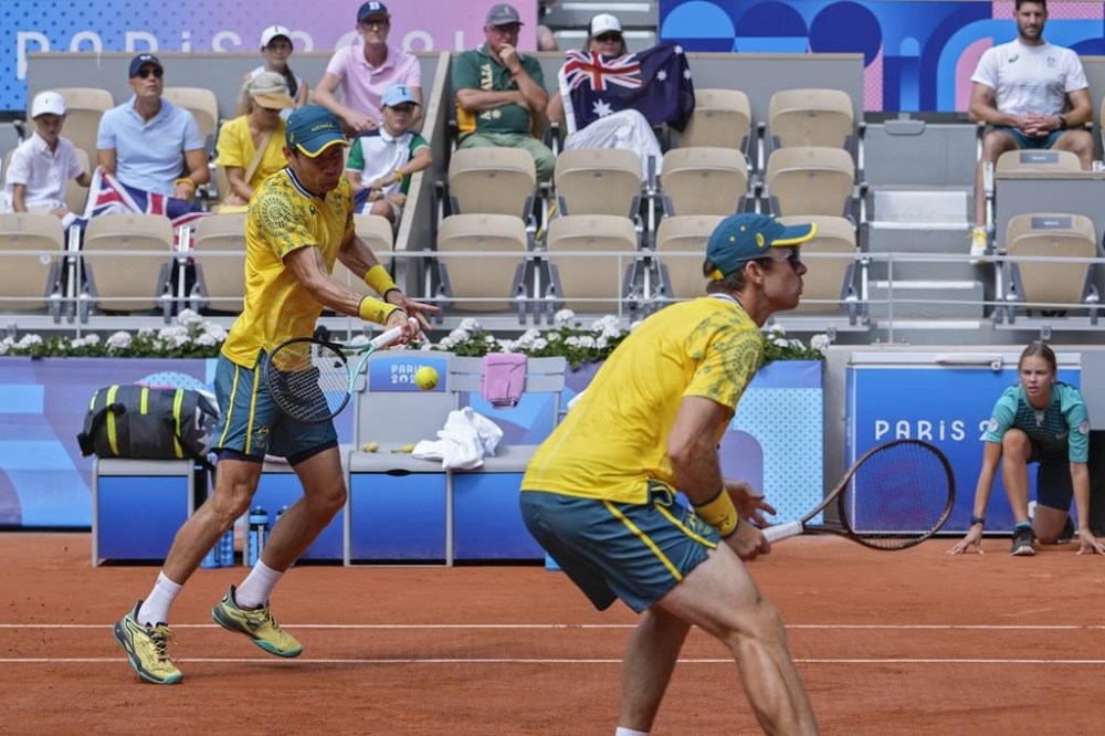Matthew Ebden and John Peers of Australia play against Austin Krajicek and Rajeev Ram of the United States during their men's doubles gold medal match at the Roland Garros stadium, at the 2024 Summer Olympics, Saturday, Aug. 3, 2024, in Paris, France. (AP Photo/Andy Wong)