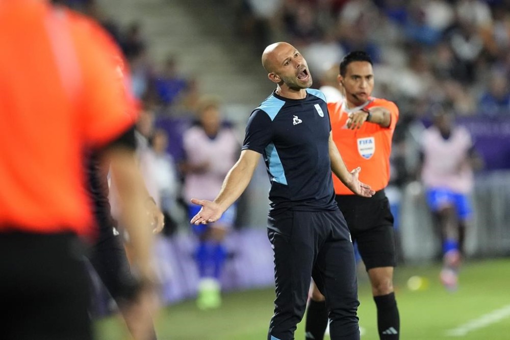 Argentina's head coach Javier Mascherano reacts during a quarter final soccer match between France and Argentina, at Bordeaux Stadium, during the 2024 Summer Olympics, Friday, Aug. 2, 2024, in Bordeaux, France. (AP Photo/Rebecca Blackwell)