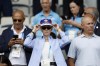 For US soccer player Megan Rapinoe adjusts her cap as she waits for the start of the quarterfinal women's soccer match between the United States and the Japan at the Parc des Princes at the 2024 Summer Olympics, Saturday, Aug. 3, 2024, in Paris, France. (AP Photo/Aurelien Morissard)