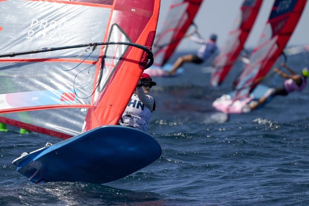 Zheng Yan, of China, participates in a women's iQFOiL windsurfing class race during the 2024 Summer Olympics, Saturday, Aug. 3, 2024, in Marseille, France. (AP Photo/Carolyn Kaster)
