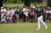 Matthew Fitzpatrick, of Britain taps in on the 5th green during the third round of the men's golf event at the 2024 Summer Olympics, Saturday, Aug. 3, 2024, at Le Golf National in Saint-Quentin-en-Yvelines, France. (AP Photo/Matt York)