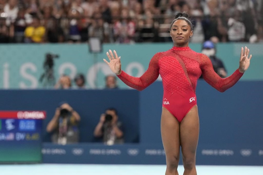 Simone Biles, of the United States, competes during the women's artistic gymnastics individual vault finals at Bercy Arena at the 2024 Summer Olympics, Saturday, Aug. 3, 2024, in Paris, France. (AP Photo/Charlie Riedel)