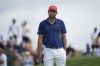 Scottie Scheffler, of the United States, waits to putt on the 5th green during the third round of the men's golf event at the 2024 Summer Olympics, Saturday, Aug. 3, 2024, at Le Golf National in Saint-Quentin-en-Yvelines, France. (AP Photo/Matt York)
