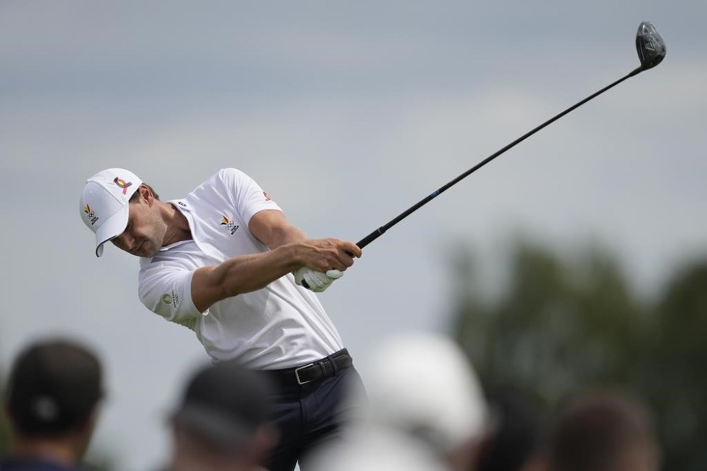 Thomas Detry, of Belgium, plays his tee shot on the 9th hole during the third round of the men's golf event at the 2024 Summer Olympics, Saturday, Aug. 3, 2024, at Le Golf National in Saint-Quentin-en-Yvelines, France. (AP Photo/Matt York)