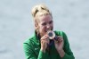 Viktorija Senkute, of Lithuania, poses with the bronze medal in the women's single sculls rowing final at the 2024 Summer Olympics, Saturday, Aug. 3, 2024, in Vaires-sur-Marne, France. (AP Photo/Ebrahim Noroozi)