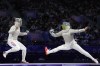 South Korea's Jeon Hayoung, left, competes with Ukraine's Alina Komashchuk in the women's team sabre final match during the 2024 Summer Olympics at the Grand Palais, Saturday, Aug. 3, 2024, in Paris, France. (AP Photo/Vadim Ghirda)