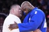 France's Teddy Riner reacts after defeating Japan's Tatsuru Saito, left, during men's +90 kg of the mixed team final match in the team judo competition, at Champ-de-Mars Arena, during the 2024 Summer Olympics, Saturday, Aug. 3, 2024, in Paris, France. (AP Photo/Eugene Hoshiko)