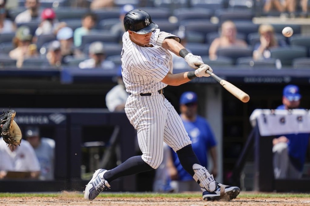New York Yankees' Anthony Volpe hits a two-run home run on a fly ball to left center field during the fifth inning of a baseball game against the Toronto Blue Jays, Saturday, Aug. 3, 2024, in New York. (AP Photo/Julia Nikhinson)