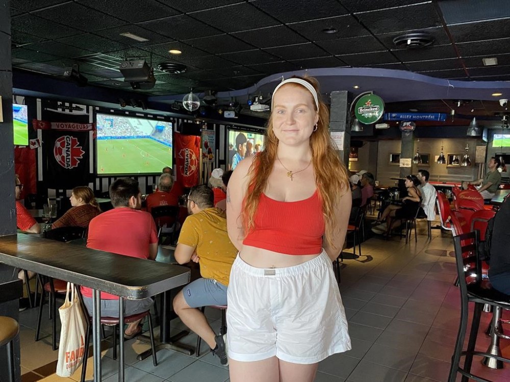Tami Piovesan, a fan of Canadian women’s soccer, joined others gathered at Bar St-Laurent Frappe to watch their team take on Germany in the quarterfinals of the Paris Olympic Games, in Montreal, Saturday, Aug. 3, 2024. Despite the heartbreak of seeing the reigning champions lose 4-2 on penalties and some tournament controversy they had plenty of reason to cheerful about. THE CANADIAN PRESS/Joe Bongiorno