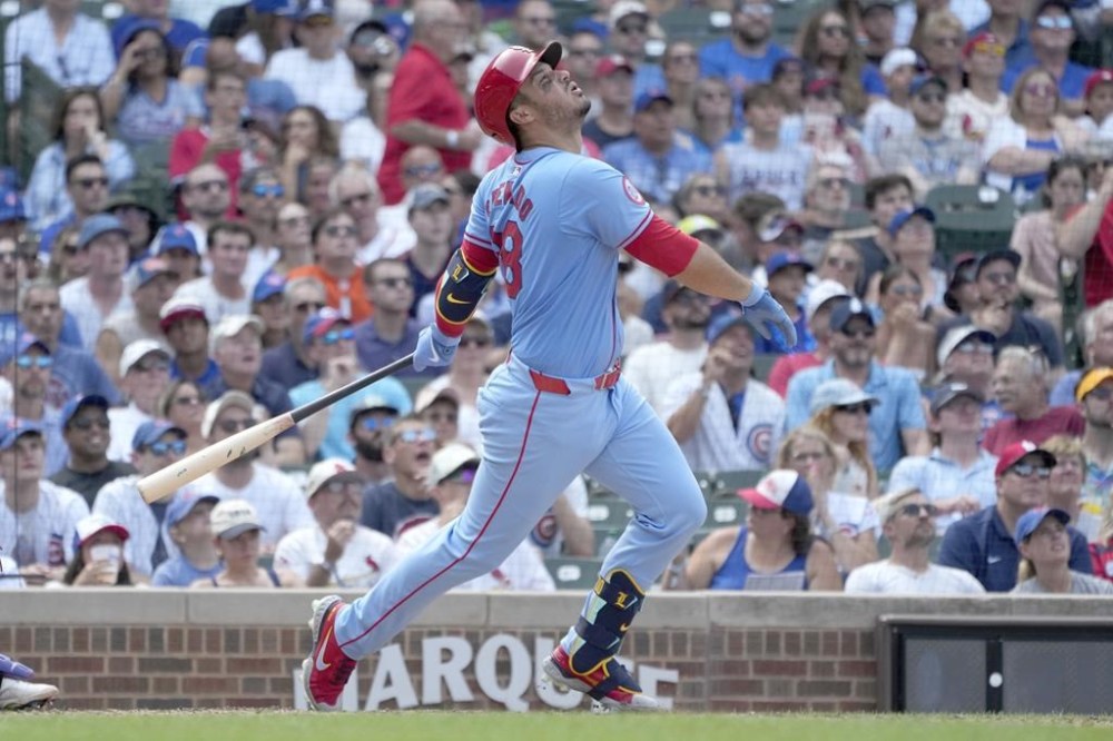 St. Louis Cardinals' Nolan Arenado watches his two-run single during the eighth inning of a baseball game against the Chicago Cubs on Saturday, Aug. 3, 2024, in Chicago. (AP Photo/Charles Rex Arbogast)