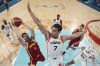 Darío Brizuela, of Spain, shoots over Dwight Powell, of Canada, in a men's basketball game at the 2024 Summer Olympics, Friday, Aug. 2, 2024, in Villeneuve-d'Ascq, France. (Gregory Shamus/Pool Photo via AP)