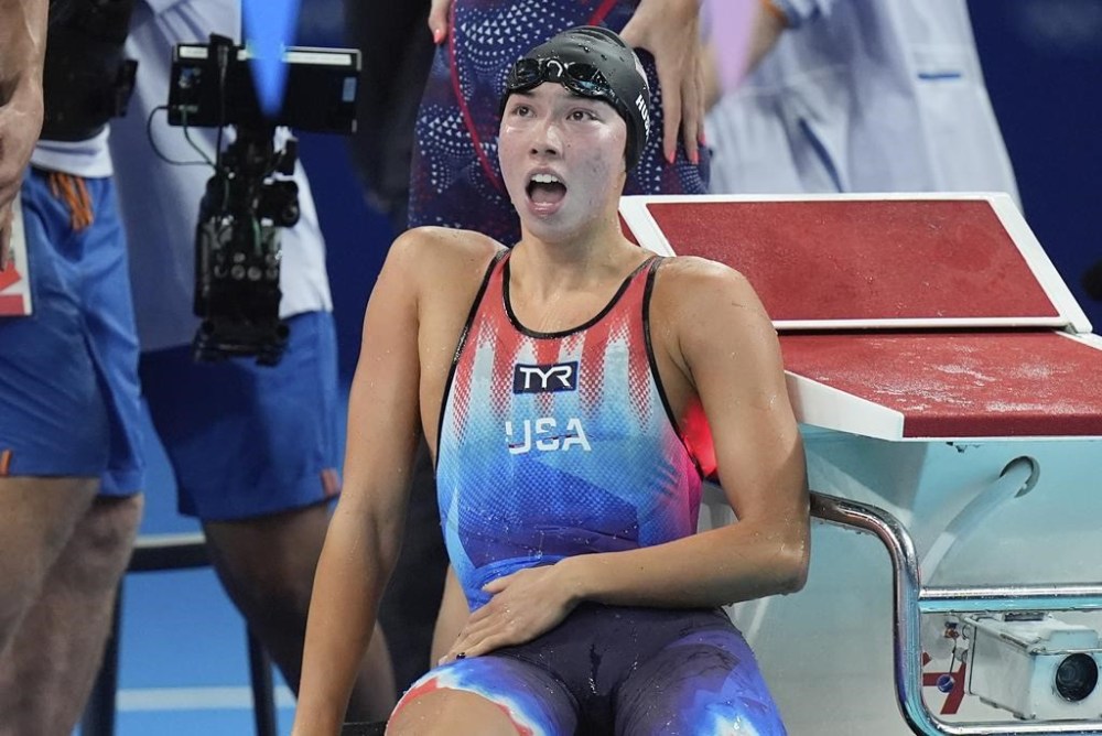 United States' Torri Huske celebrates winning the last lap in the mixed 4x100-meter medley relay final at the Summer Olympics in Nanterre, France, Saturday, Aug. 3, 2024. (AP Photo/Brynn Anderson)