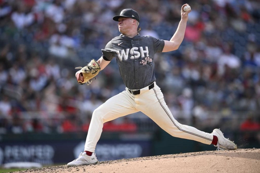 Washington Nationals starting pitcher DJ Herz throws during the fifth inning of a baseball game against the Milwaukee Brewers, Saturday, Aug. 3, 2024, in Washington. (AP Photo/Nick Wass)