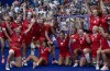 Team Canada celebrates during a team photo after defeating Australia in rugby sevens semi-inal action at the Summer Olympics, Tuesday, July 30, 2024 in Paris. Canada's team in Paris is on pace for a record Olympic Games at halftime after a mortifying soccer scandal that began before the flameless eco-flame was even lit in Jardin des Tuileries. THE CANADIAN PRESS/Adrian Wyld