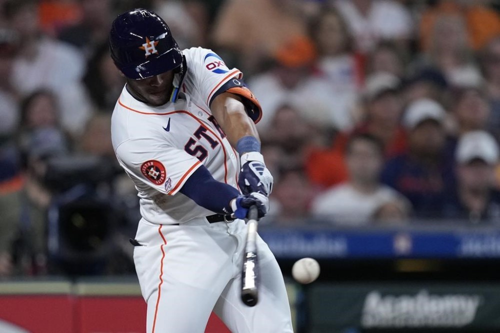 Houston Astros' Pedro León connects for his first major league hit during the third inning of a baseball game against the Tampa Bay Rays, Saturday, Aug. 3, 2024, in Houston. (AP Photo/Kevin M. Cox)