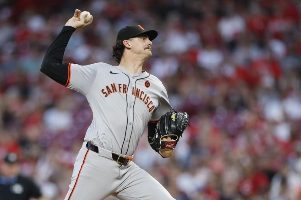 San Fransisco Giants relief pitcher Sean Hjelle throws against the Cincinnati Reds during the fifth inning of a baseball game, Saturday, Aug. 3, 2024, in Cincinnati. (AP Photo/Jay LaPrete)