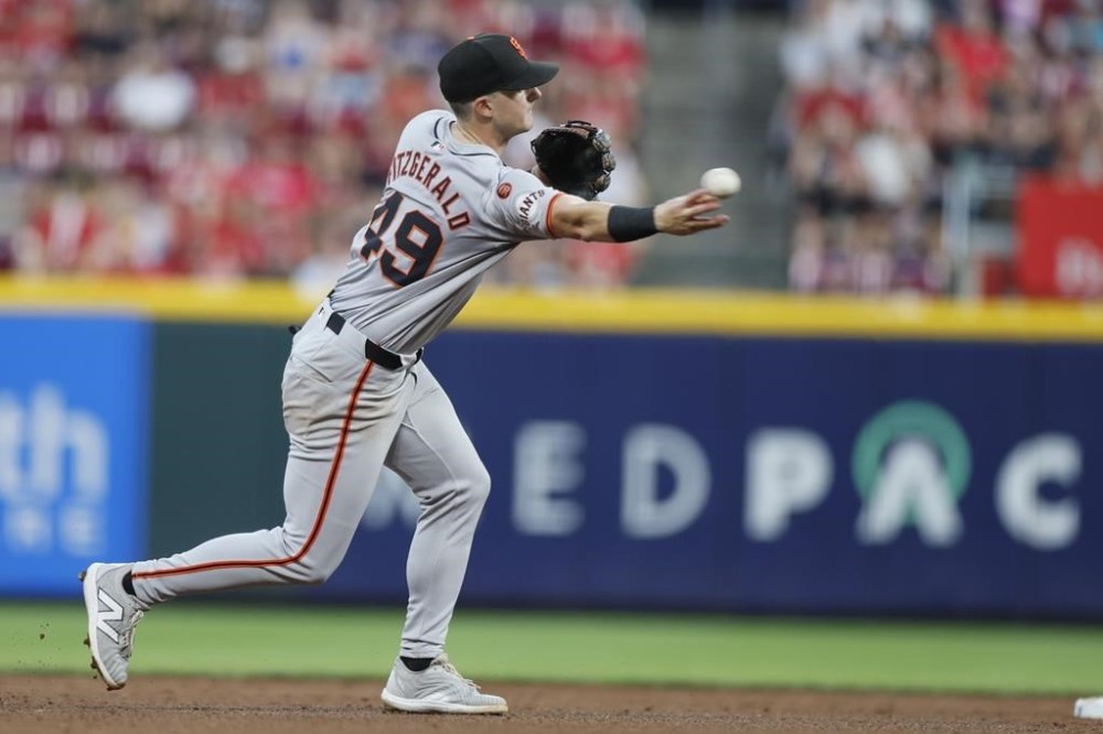 San Fransisco Giants shortstop Tyler Fitzgerald throws out Cincinnati Reds' Ty France during the fifth inning of a baseball game, Saturday, Aug. 3, 2024, in Cincinnati. (AP Photo/Jay LaPrete)