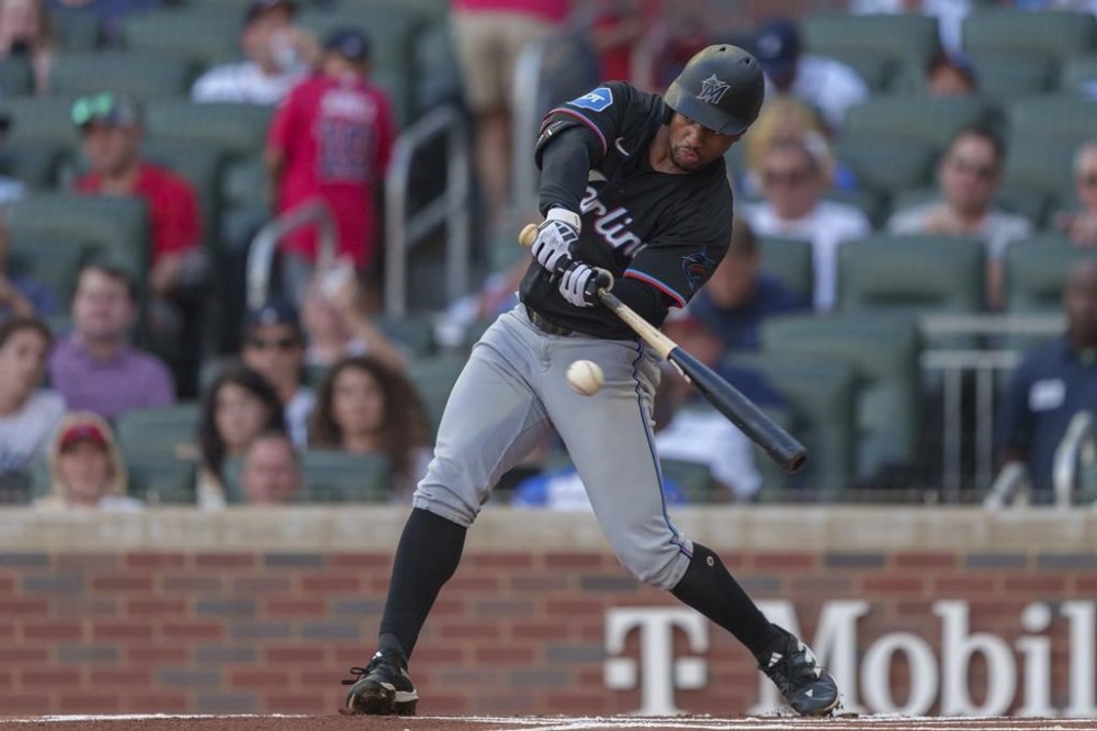 Miami Marlins Xavier Edwards swings for a strike in the first inning of a baseball game against the Atlanta Braves, Saturday, Aug. 3, 2024, in Atlanta. (AP Photo/Jason Allen)
