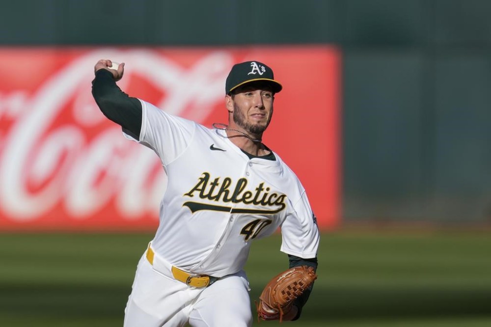 Oakland Athletics pitcher Mitch Spence throws to a Los Angeles Dodgers batter during the first inning of a baseball game, Saturday, Aug. 3, 2024, in Oakland, Calif. (AP Photo/Godofredo A. Vásquez)