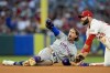 New York Mets' Jeff McNeil, left, reacts after being tagged out by Los Angeles Angels second baseman Michael Stefanic, right, during the fifth inning of a baseball game, Saturday, Aug. 3, 2024, in Anaheim, Calif. The call was challenged but upon review it was upheld. (AP Photo/Ryan Sun)