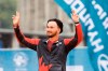 Silver medallist Eric Peters from Canada waves during the award ceremony for the men's Olympic recurve bow individual competition at the Archery World Championship in Berlin, Germany, Sunday, Aug. 6, 2023. (Christoph Soeder/dpa via AP)