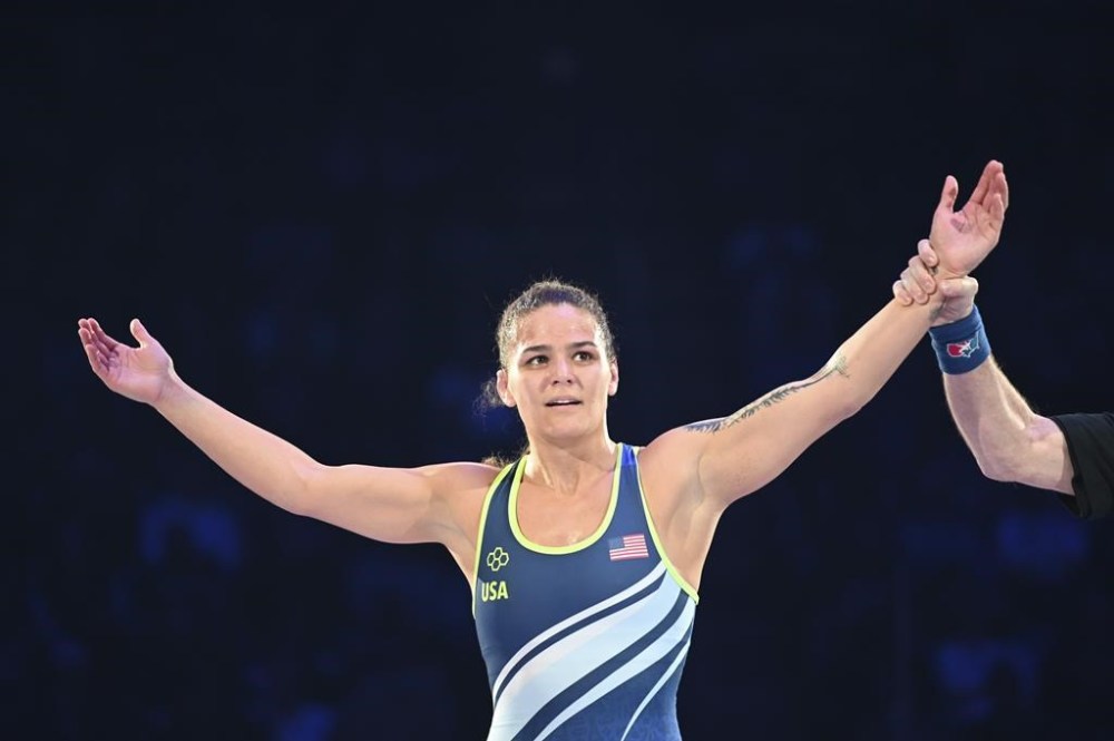 FILE - Kayla Miracle raises her arms after winning a 62-kilogram bout in the finals at the U.S. Olympic wrestling trials in State College, Pa., Saturday, April 20, 2024. (AP Photo/Aidan Conrad, File)