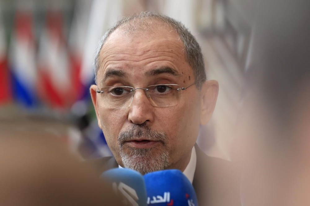 FILE - Jordan's Minister of Foreign Affairs Ayman Safadi speaks with the media as he arrives for a meeting at the European Council building in Brussels, Monday, May 27, 2024. Jordan's foreign minister is expected in Iran on Sunday, Aug. 4, 2025, according to Iranian media, as the United States and its Arab allies try to prevent a wider war after the back-to-back killings of top Iran-allied militants sparked vows of revenge against Israel. (AP Photo/Geert Vanden Wijngaert, file)