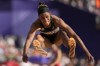 Thea Lafond, of Dominica, makes an attempt in the women's triple jump qualification at the 2024 Summer Olympics, Friday, Aug. 2, 2024, in Saint-Denis, France. (AP Photo/Bernat Armangue)
