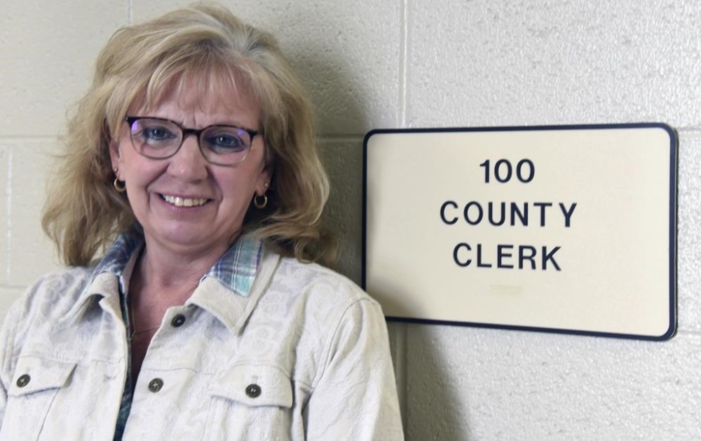 Antrim County Clerk Sheryl Guy is photographed, Thursday, Feb. 18, 2021 in Bellaire, Mich. Guy had been planning to retire, but said she will mount a write-in campaign this year if one of her county's Republicans who were involved in efforts to cast doubt on the results of the 2020 presidential election in Michigan win in Tuesday's primary. (John L. Russell/The Detroit News via AP)