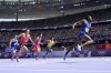 Grant Holloway, of the United States, wins a heat in the men's 110-meter hurdles at the 2024 Summer Olympics, Sunday, Aug. 4, 2024, in Saint-Denis, France. (AP Photo/David J. Phillip)