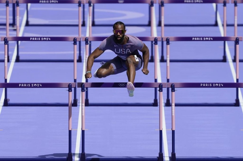 Freddie Crittenden, of the United States, competes in a men's 110 meters hurdles round 1 heat at the 2024 Summer Olympics, Sunday, Aug. 4, 2024, in Saint-Denis, France. (AP Photo/Martin Meissner)