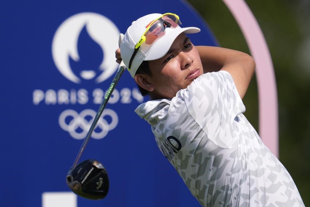 Phachara Khongwatmai, of Thailand, plays his tee shot on the 4th hole during the first round of the men's golf event at the 2024 Summer Olympics, Thursday, Aug. 1, 2024, at Le Golf National in Saint-Quentin-en-Yvelines, France. (AP Photo/George Walker IV)