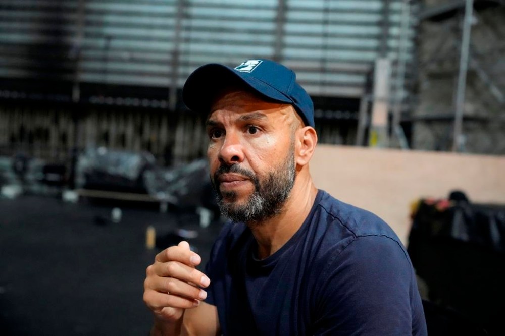 French-Algerian choreographer Mourad Merzouki guides his dancers as they rehearse for