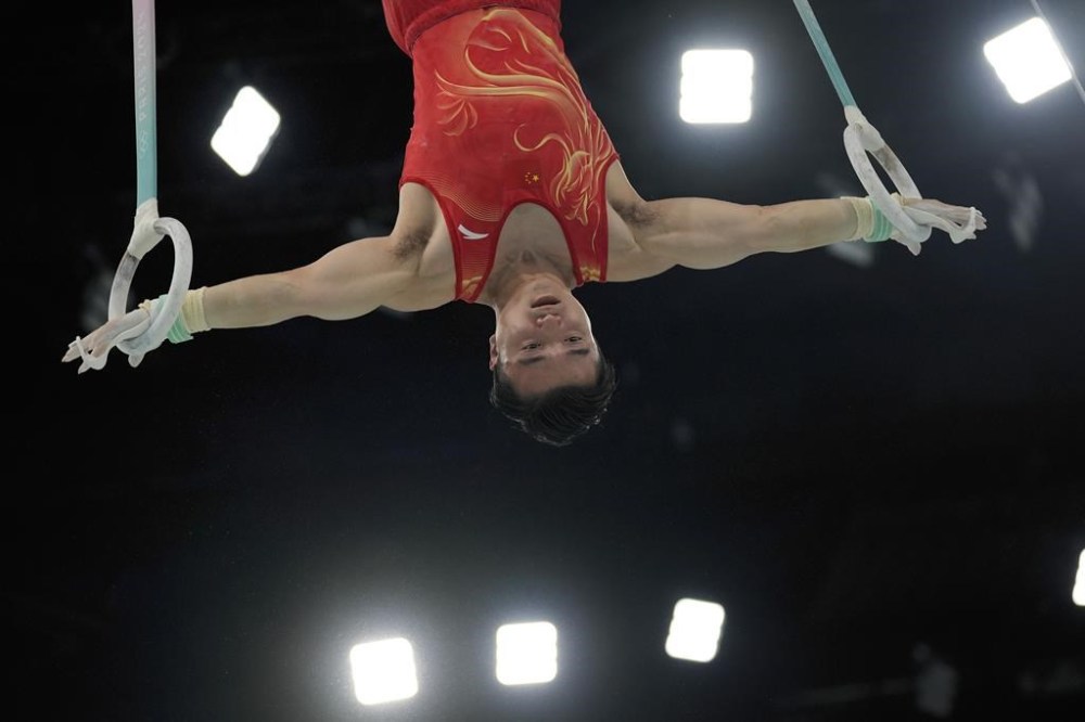 Liu Yang, of China, rings during the men's artistic gymnastics team finals round at Bercy Arena at the 2024 Summer Olympics, Monday, July 29, 2024, in Paris, France. (AP Photo/Francisco Seco)