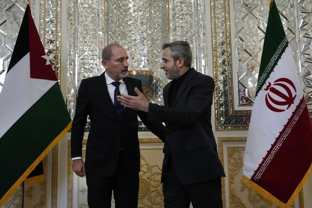 Iran's acting Foreign Minister Ali Bagheri Kani, right, welcomes Jordan's Foreign Minister Ayman Safadi for their meeting, in Tehran, Iran, Sunday, Aug. 4, 2024. (AP Photo/Vahid Salemi)