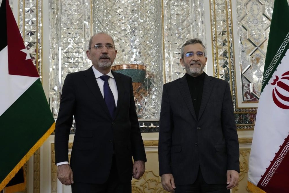 Iran's acting Foreign Minister Ali Bagheri Kani, right, welcomes Jordan's Foreign Minister Ayman Safadi for their meeting, in Tehran, Iran, Sunday, Aug. 4, 2024. (AP Photo/Vahid Salemi)