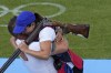 Chile's Francisca Crovetto Chadid, right, celebrates with coach after winning the gold medal in the Skeet women's final at the 2024 Summer Olympics, Sunday, Aug. 4, 2024, in Chateauroux, France. (AP Photo/Manish Swarup)